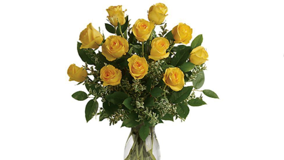Say Yellow Bouquet · Hello yellow! A dozen big, bold, sunshine roses are the surest way to brighten anyone's day. These beauties are delivered with fresh greens in a graceful glass vase.
