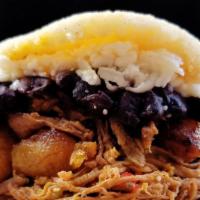 Pabellon Arepas · Venezuelan national dish. Shredded beef, black beans, sweet plantains, and cheese.