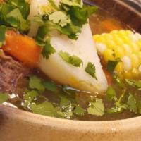Hervidos · Beef Short Rib Soup (Hervido de Costilla de Res) comes with two sides: rice, and arepa (frie...