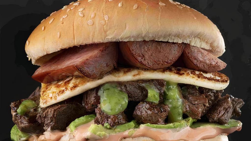 Churrasco Burger · Prime Churrasco (steak), and chorizo (sausage, topped with avocado, fried cheese and house sauce.