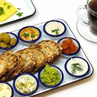 Mediterranean Breakfast · OJ • Drip Coffee • Zak the Baker Bread • Side of Olives • Just Egg Fold • Spreads: Hummus • ...