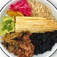 La Venezolana · White Rice • Shredded Beaf • Black Beans • Sweet Plantain • Avocado Mash • Roasted Mushrooms...