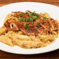 Blackened Chicken Pasta  · Blackened Chicken Breast on top of Creamy Parmesan Alfredo Sauce with sauteed tri-colored be...