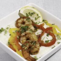 Shrimp And Grits  · Sauteed shrimp in a house-made roux seasoned with a select blend of spices and sauteed peppe...