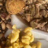 Family Pack · Choice of 24 oz of our slow smoked chopped pork, brisket or chicken, 12 oz of baked beans, 1...