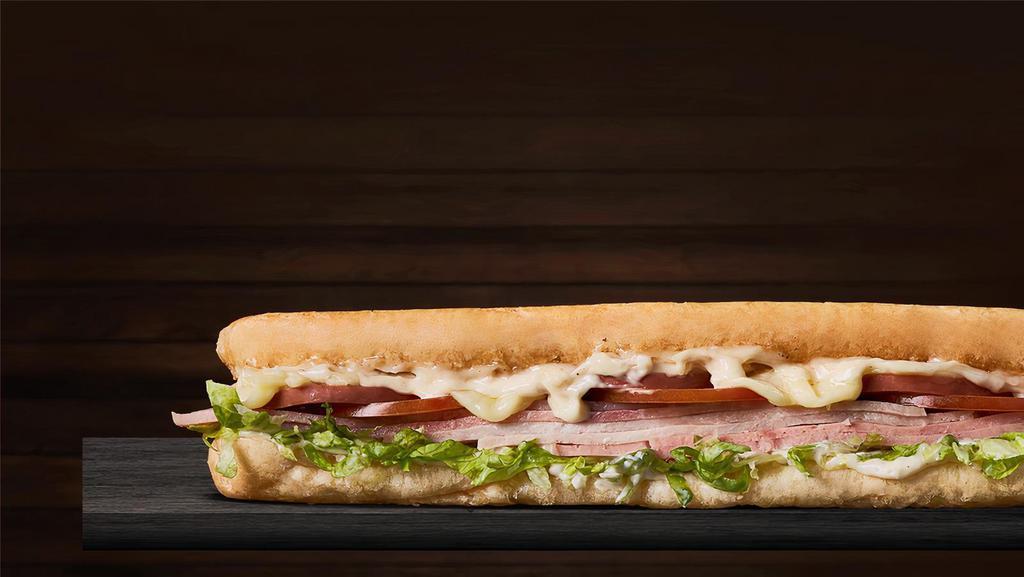 Super Special Sandwich · French bread, roast beef, ham, cooked pork, salami, tomatoes, mozzarella cheese, lettuce, and home style sauce.