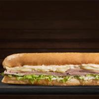 Cooked Pork Sandwich · French bread, cooked pork, mozzarella cheese, lettuce, and home style sauce.
