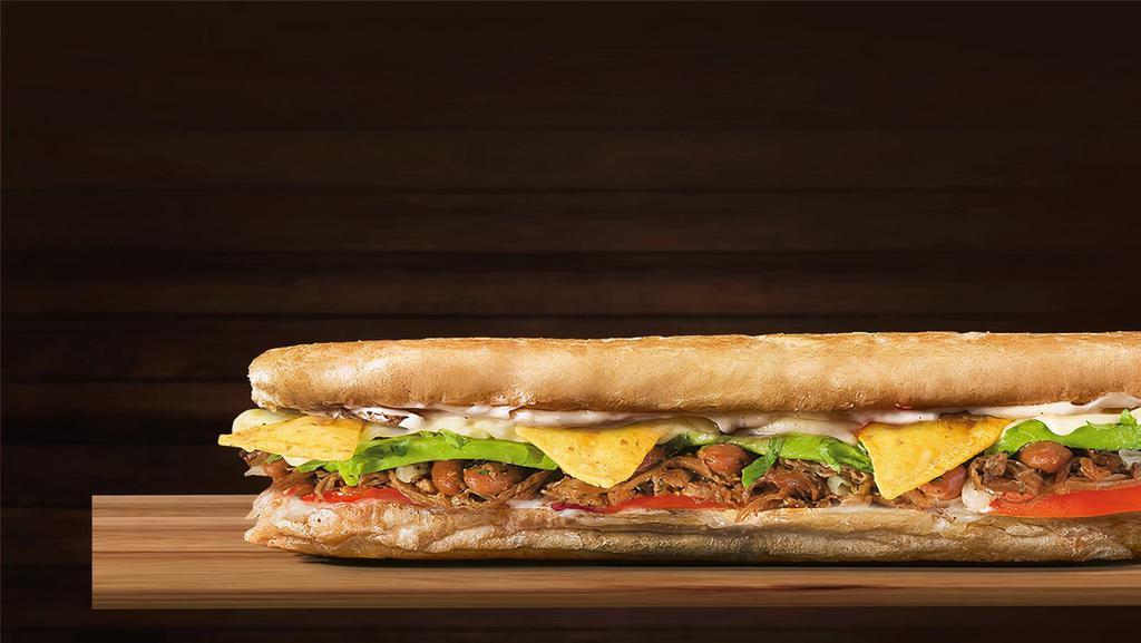 Mexican Sandwich · French bread, shredded beef, chilli beans, onions, mozzarella cheese, lettuce, tomatoes, avocado sauce, and home style sauce.