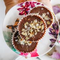 Almond Butter Cup · Almond butter, cacao, maple syrup, coconut oil, maldon salt.