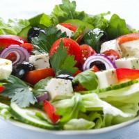 Mazzat Greek Salad · Tomatoes, cucumbers, olives, onions, feta cheese. Dressing: olive oil.