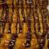 Drizzle Churros · Five pieces cinnamon churros with drizzle of your choice.