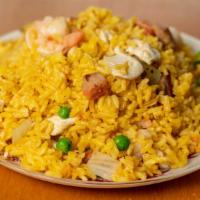 House Special Fried Rice · Stir fried yellow rice with onion, peas, pork, chicken, and shrimp.