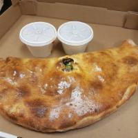 Calzone · Oven-baked folded pizzas come with ricotta cheese and mozzarella.