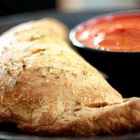 Cheese Calzone · Blended mozzarella cheese and ricotta cheese. Served with a side of our marinara sauce.