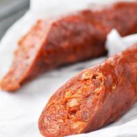 Chorizo Catalan · Cooked in red wine.