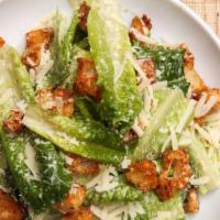 Caesar Salad · Crisp romaine lettuce, bacon bits, garlic and herb croutons, drizzled with a traditional dre...