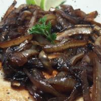 Caramelized Chicken · Caramelized chicken breast prepared with sauce and onions.