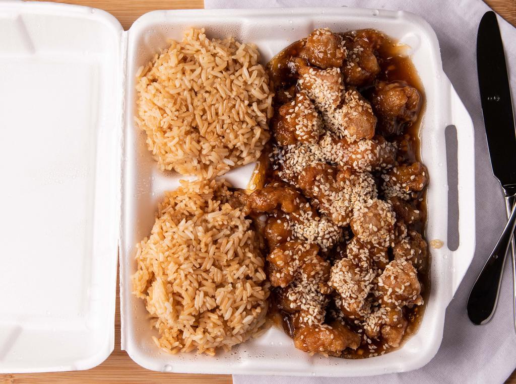 Sesame Chicken · Lightly fried chicken chunks with gravy and sesame seeds on top.