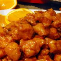 Orange Flavored Chicken · Hot and spicy. Quick fried diced chicken cooked with dried orange peel and enhanced by a tan...