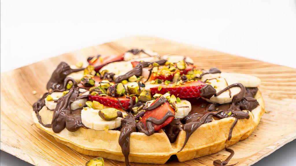 Farigliano Waffle · Belgian waffle, nutella, strawberry, banana, pistachios, vanilla ice cream.
