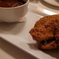 Crispy Chicken Strips · Served with a side of spaghetti and red sauce.