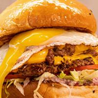 Boedo · Two 4oz beef patties with american cheese, diced red onion, lettuce, tomato and fried cage-f...