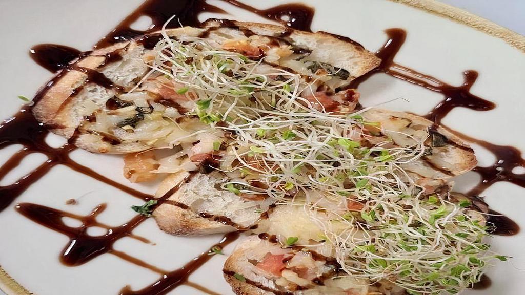 Bruschettas (3 Pieces) · Vegan mozzarella, garlic, tomato and basil topped with balsamic glaze and sprouts.