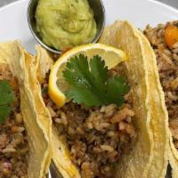 Impossible Tacos · 3 corn tortillas topped with impossible meat, brown rice, yellow onion, pico de gallo, cilan...