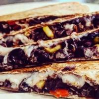 Quinoa Black Beans & Corn Quesadilla · Black beans, corn, quinoa, red peppers, vegan mozzarella on a whole wheat tortilla; served w...