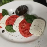 Caprese Salad · Fresh Mozzarella, Vine Rip Tomatoes, Basil, Balsamic Reduction & Vinaigrette