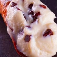 Cannoli · A flaky pastry shell stuffed with a chocolate chip cannoli cream.