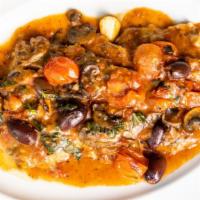 Scaloppine Piccata · Tender veal medallions pounded thin and sauteed with capers in a light white wine and lemon ...
