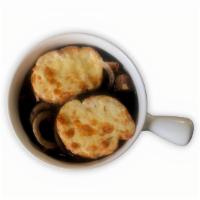 French Onion Soup · A beef broth based soup filled with onions and spices., Garnished with cheese and croutons.