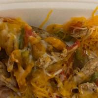 Chicken Spud · Chicken, onions, multicolored peppers and shredded cheese.