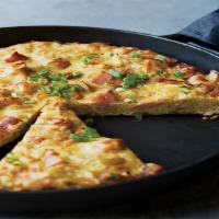 Spicy Spanish Omelette · Loaded with spicy chorizo, chili pepper red onion, diced tomato, and potatoes, and 1 side in...