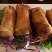 Spring Roll · Deep-fried crispy spring rolls filled with pork, shrimp, and veggies served with pineapple s...