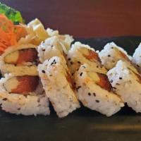 Spicy Tuna Roll · Spicy. Chopped tuna, cucumber, scallion, tempura flake, spicy sauce, and with sesame seed.