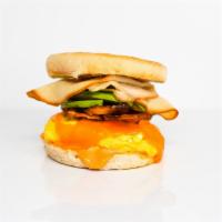 English Muffin, Bacon, Turkey, Avocado, Egg, & Cheddar · 2 scrambled eggs, melted Cheddar cheese, crispy bacon, sliced smoked turkey, avocado, and Sr...