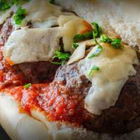 King Meat Ball Sub · Homemade king size meat balls covered in red marinara or white alfredo sauce, topped with mo...