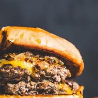 Burger Medium · Black Angus Burger is a single patty, your choice of cheese, smothered in caramelized onions...