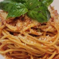 Spaghetti Tomato Sauce & Basil · Spaghetti with homemade tomato sauce and basil, with parm cheese on top.
