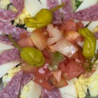 Anti Pasta Salad · Mixed greens, genoa salami, provolone, black olives, artichokes, eggs, red onion, tomatoes, ...