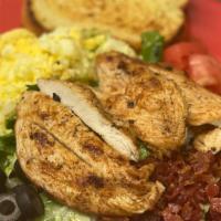 Cobb Salad  · Mixed greens, fried chicken, bacon, black olives, eggs, and tomatoes. Served with Gorgonzola...