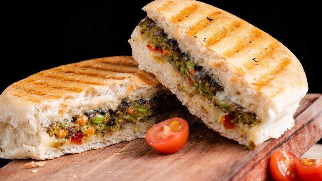 Pesto Chicken · Grilled Chicken Breast, Pepper Jack Cheese, Roasted Red Peppers, topped with Basil Pesto grilled on a Rosemary and Cheese Focaccia Bun.