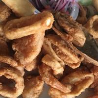 Chicharron De Calamar · Deep fried calamari rings.