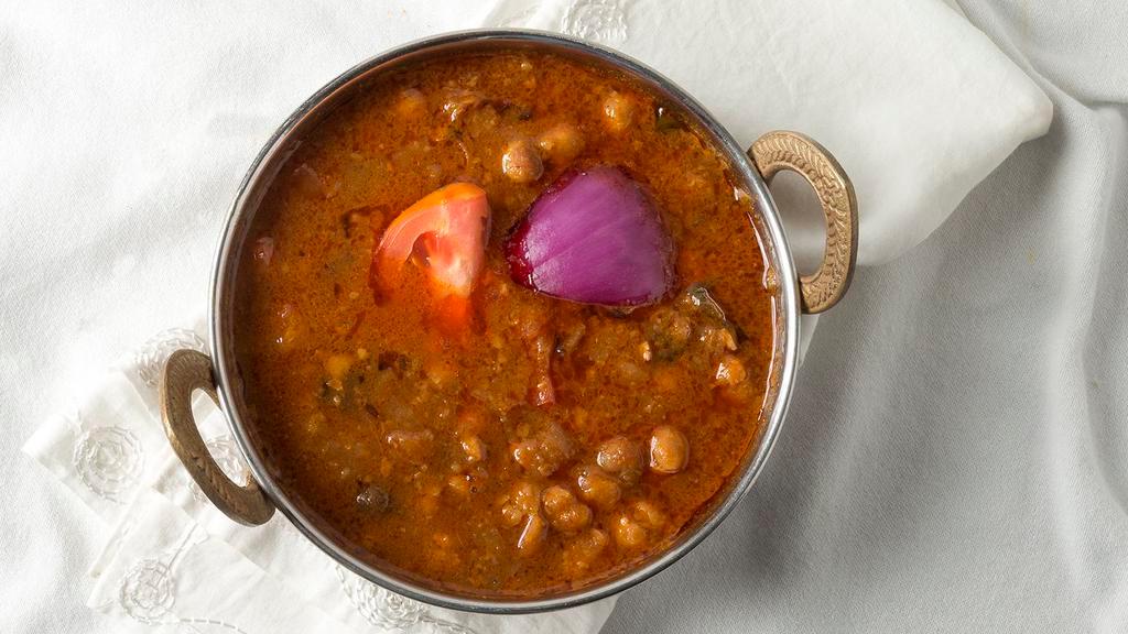 Chana Masala · Garbanzo beans cooked with onion and tomato sauce.