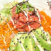 Poke Bowl · Served with masago, carrot, avocado, sesame seed, spicy mayo and fish on top.