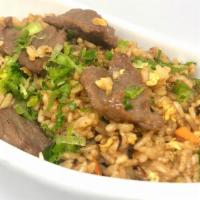 Beef Fried Rice · Beef, egg, onion, broccoli, and carrot.