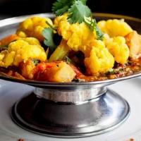 Aloo Gobi · Cauliflower florets and potatoes sauteed with grilled onion, turmeric, ginger, garlic, and c...