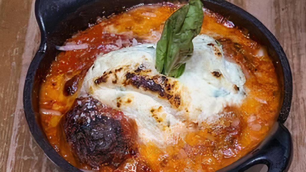 Polpette · Meatballs, house tomato sauce, parmesan, mozzarella, and ricotta cheese.